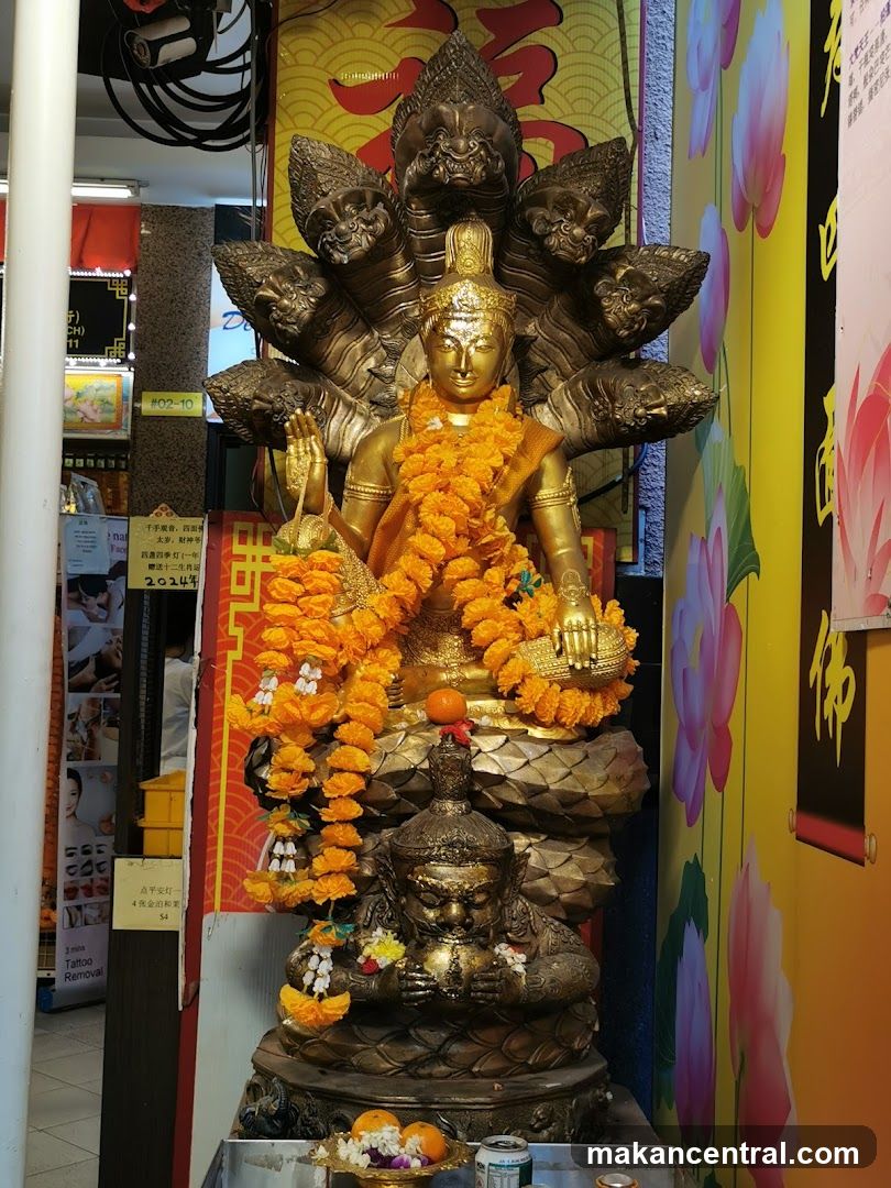 Golden Statue with Offerings