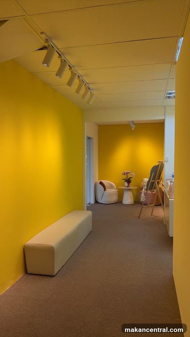 Bright Yellow Hallway with Seating