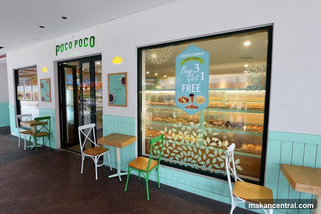The exterior of a bake shoppe with a large display window showcasing various pastries. The shop's name, "POCO POCO BAKE SHOPPE", is visible above the entrance. There are outdoor seating areas with tables and chairs. A promotional sign in the window reads "GREATER SAVINGS START TODAY Buy 3 Get 1 FREE".