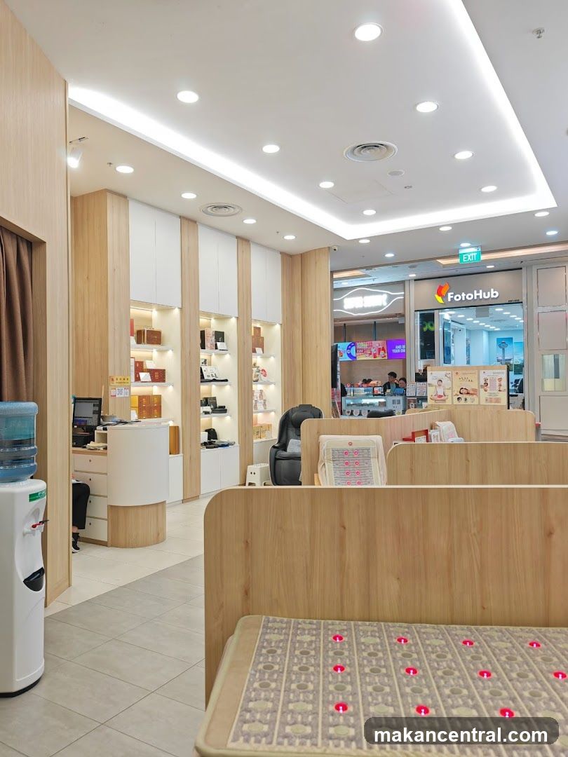 Interior of a retail store with display shelves and a massage chair