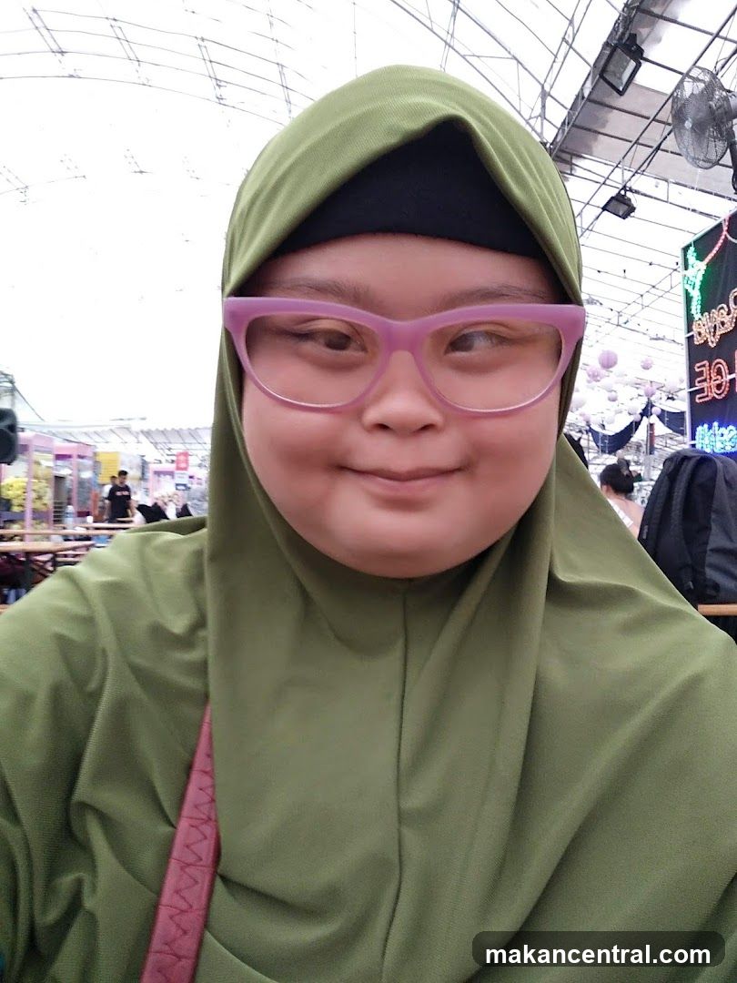 Woman wearing a hijab and glasses