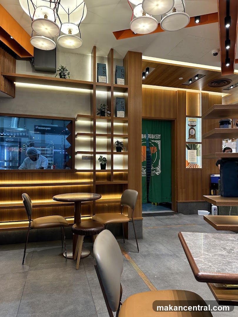 Interior of a cafe with seating and shelves