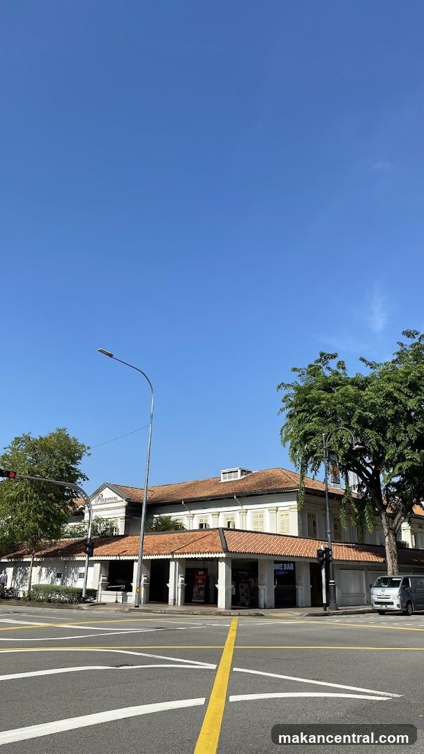 Street View of Building with Red Roof and Trees