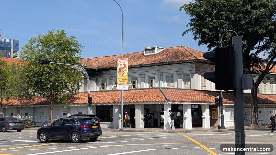 Street View of Building with Red Roof and Shopfront