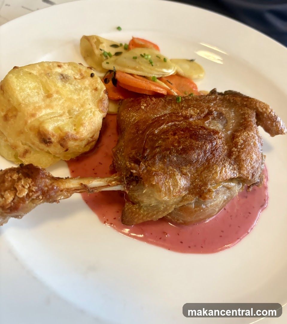 Duck dish with side vegetables and sauce