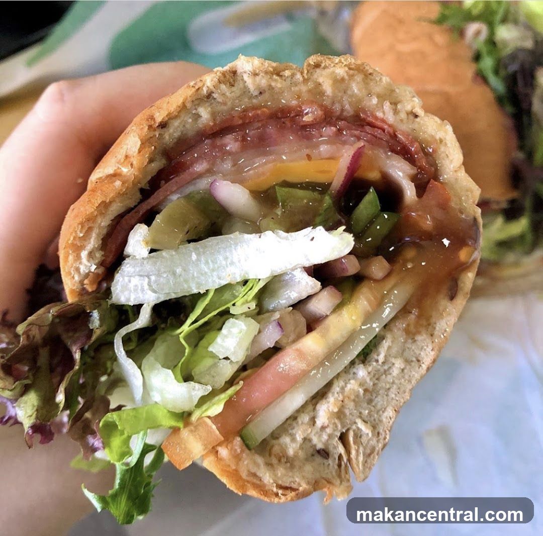 Hand holding sandwich