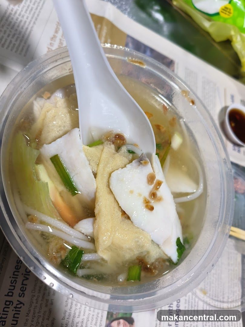 Food in plastic bowl with spoon