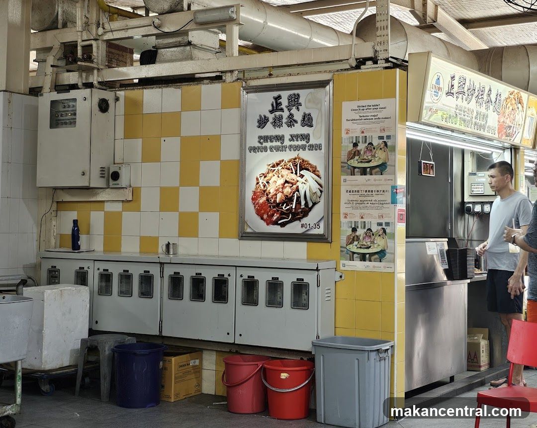 Food stall interior with signage and equipment