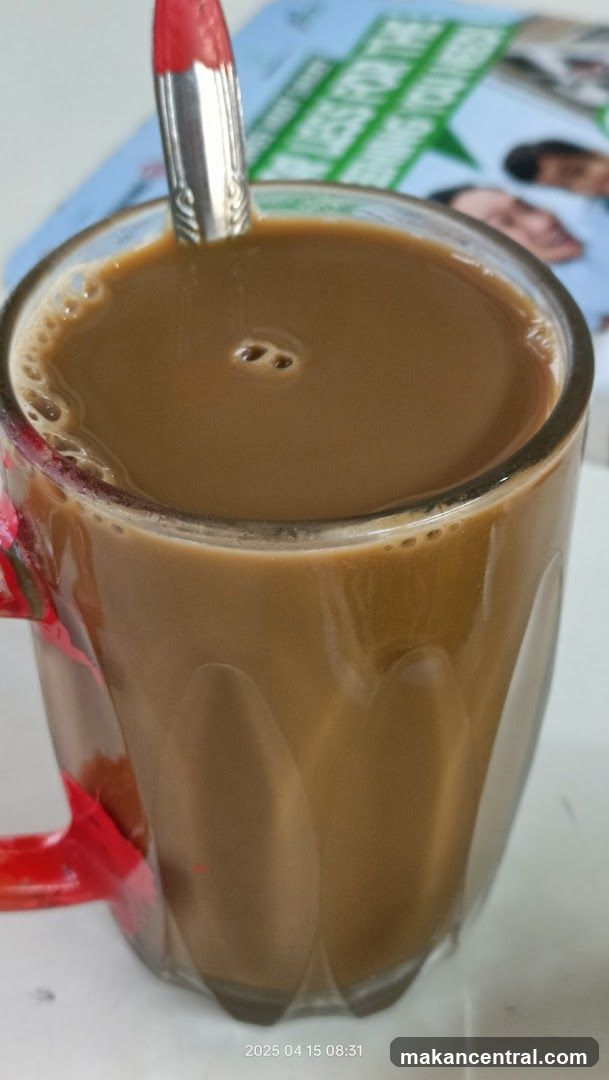 Cup of beverage with spoon