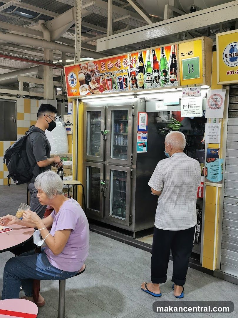 Interior of a hawker center with beverage stall