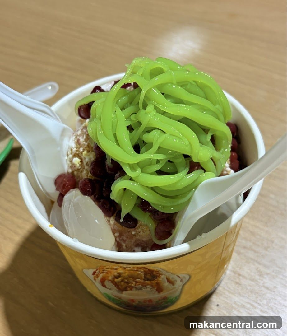 Ice cream dessert with green noodles and red beans