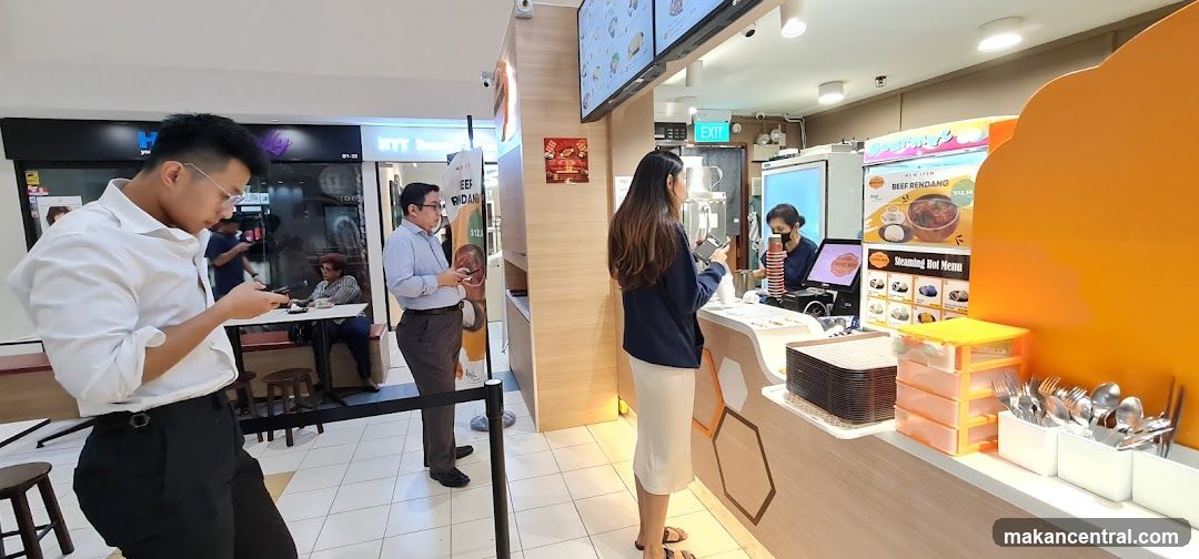 Interior of food court with customers and counter