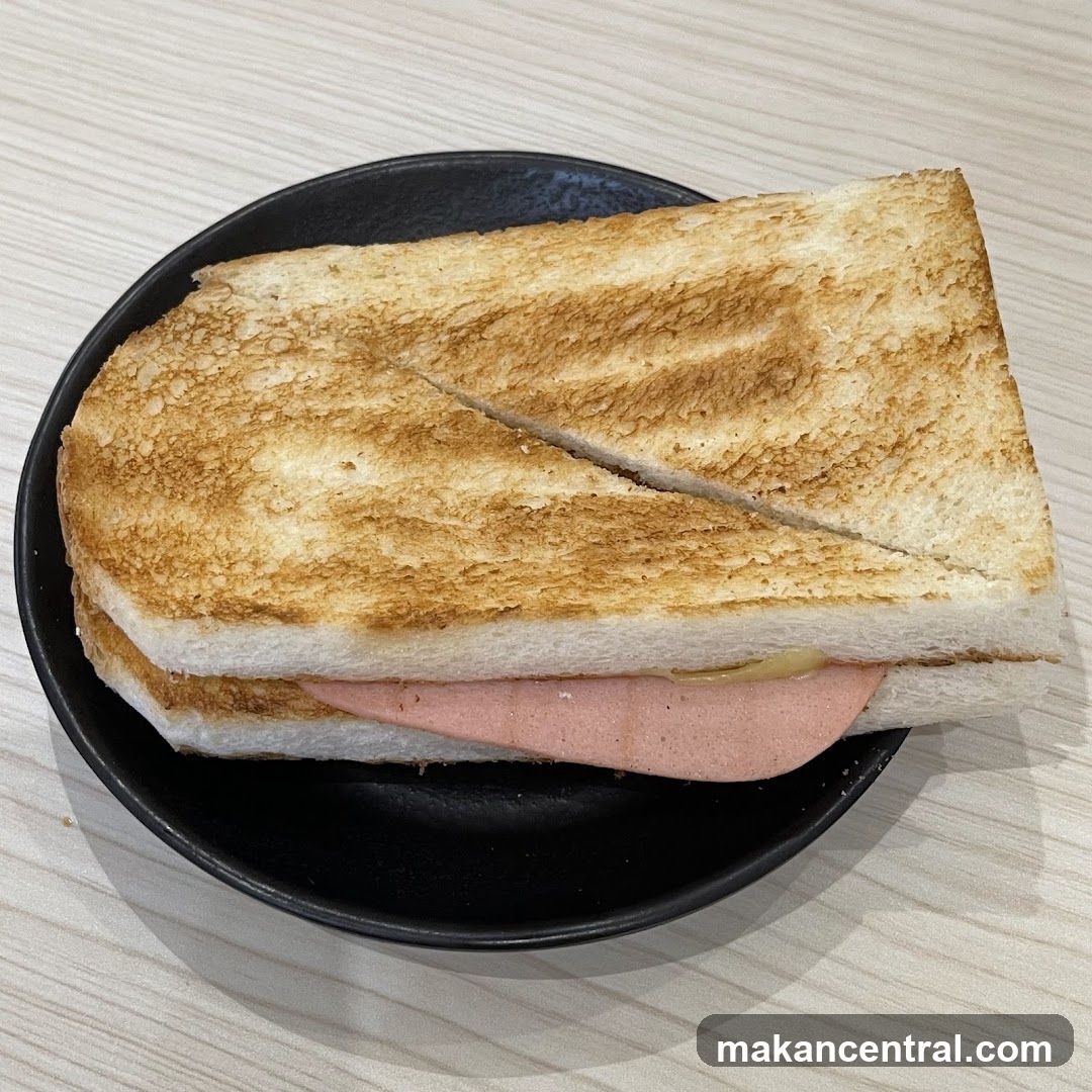 Toasted Sandwich on Black Plate