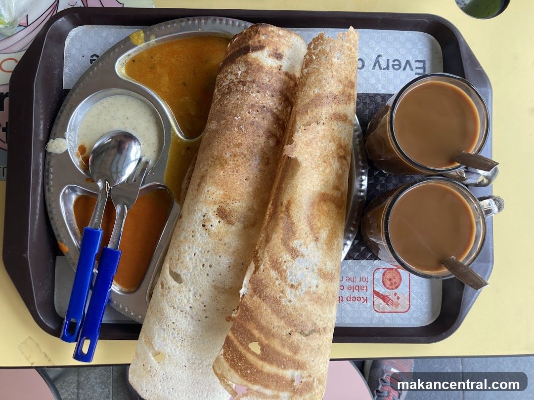 Food tray with dosa and tea