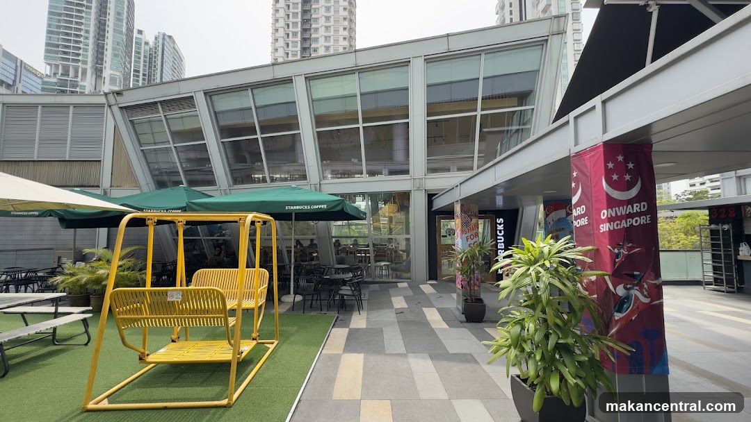 Outdoor seating area with Starbucks storefront