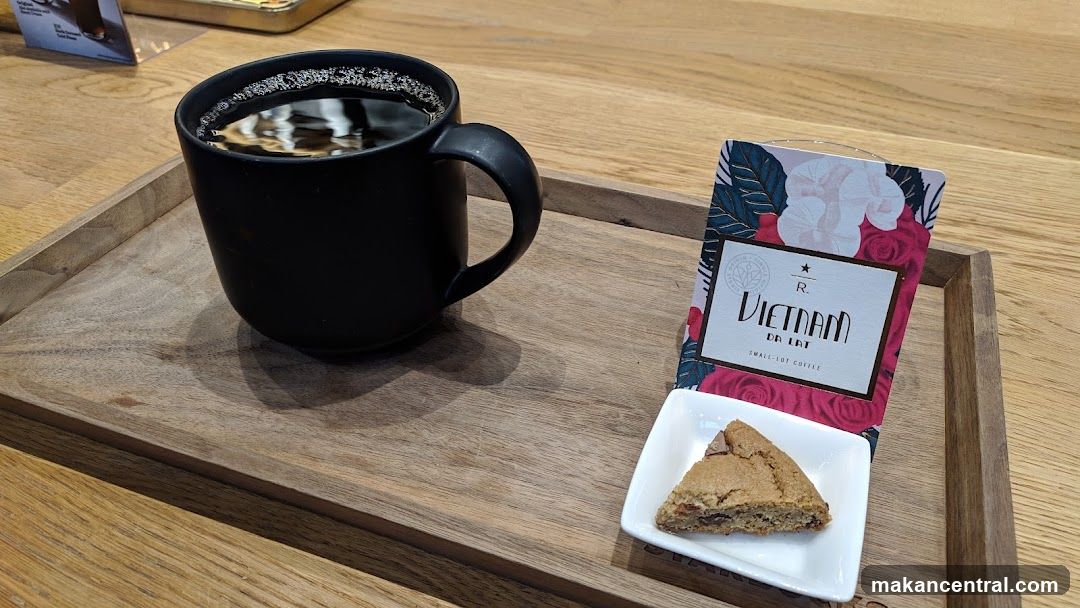 Coffee and pastry on wooden tray