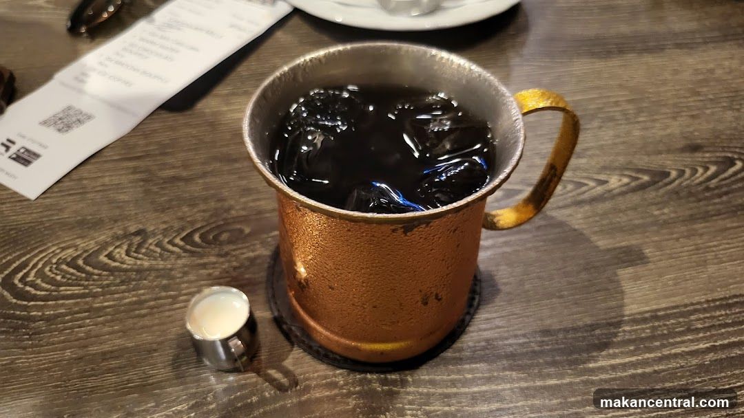 Tabletop with beverage and printed material