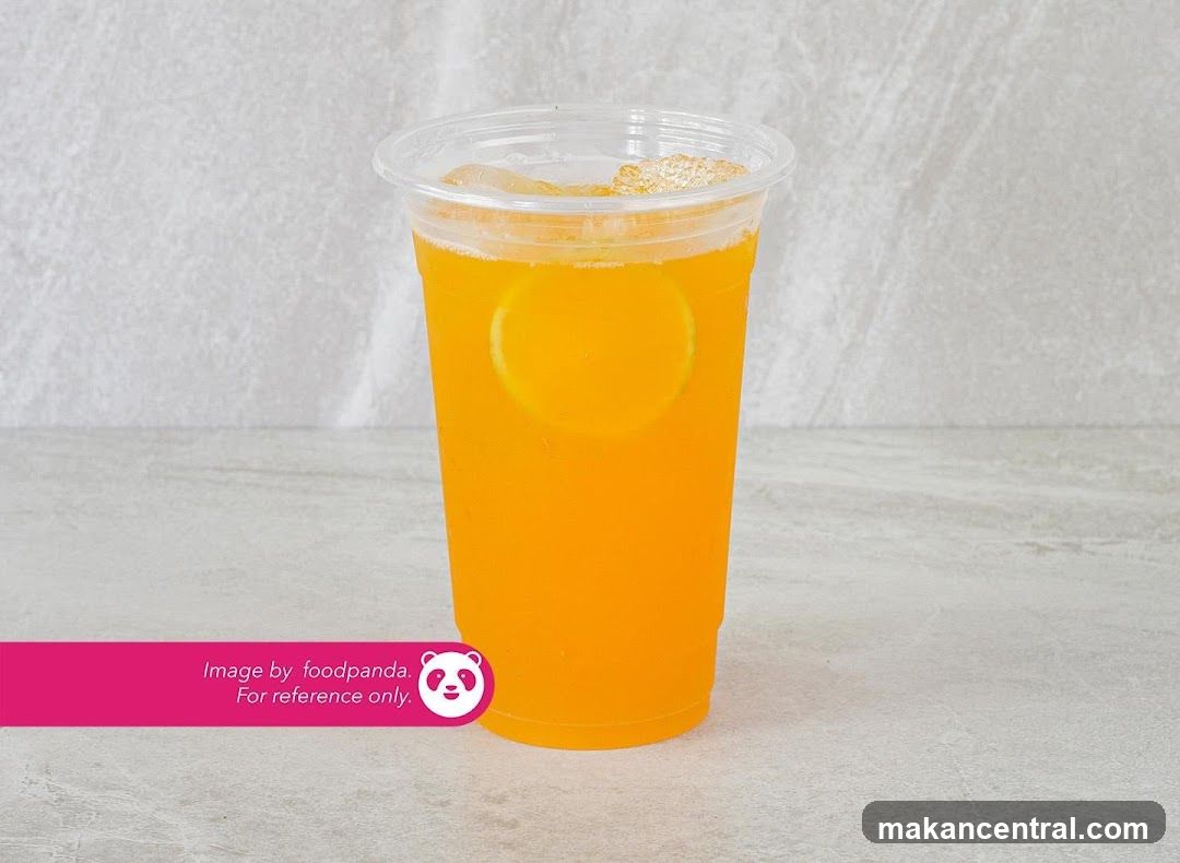 Orange beverage in plastic cup