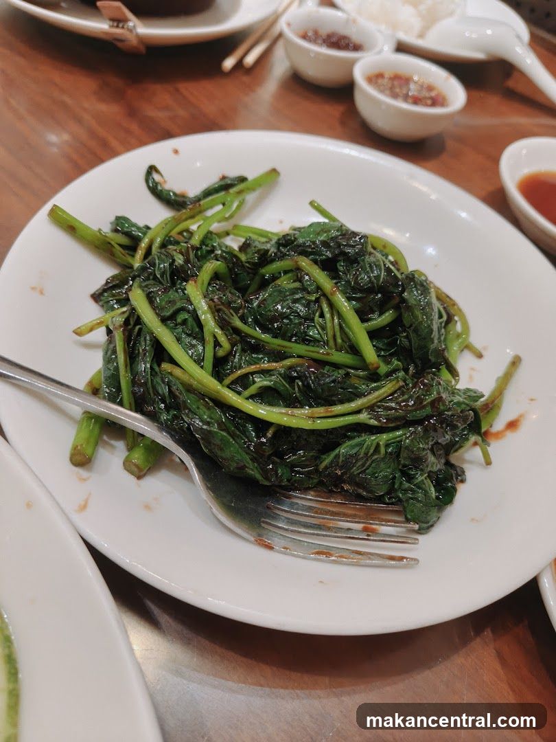 Dining Table with Stir-Fried Greens