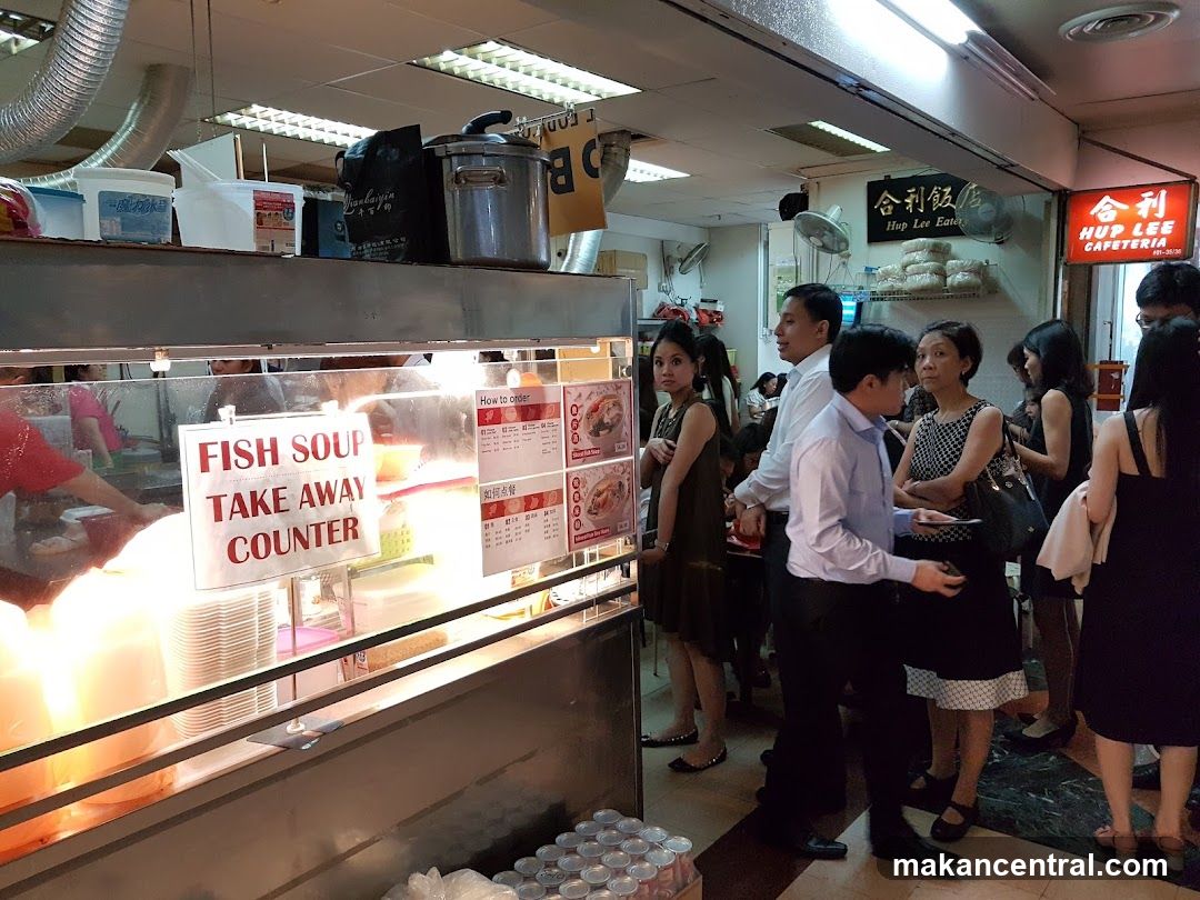 Interior of a food stall with customers waiting