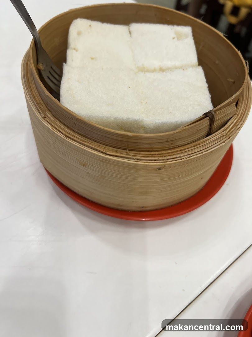 Bamboo steamer with white food item