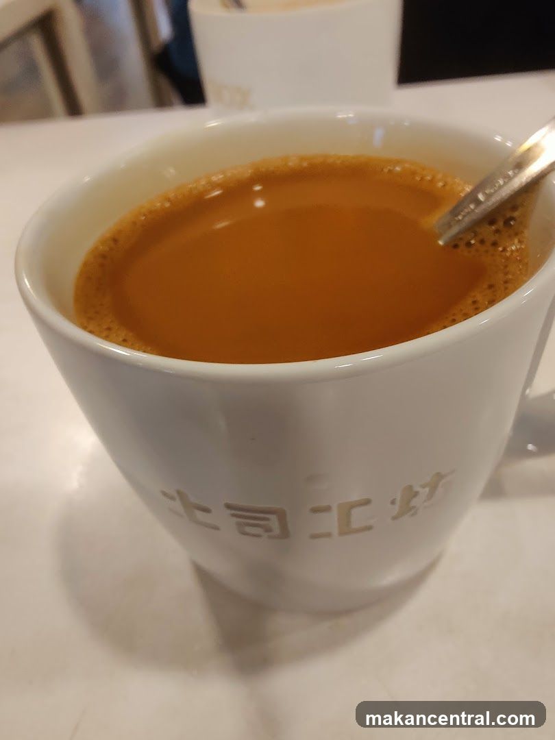 Cup of beverage with spoon