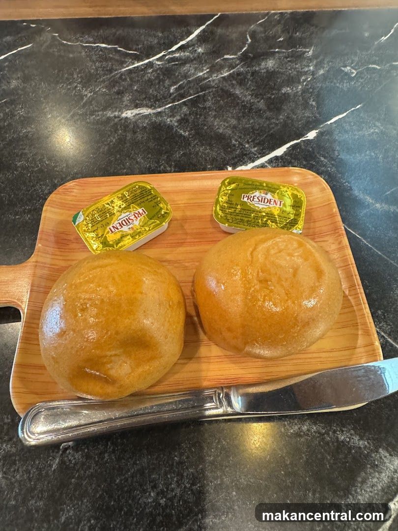 Bread and Butter on Wooden Board