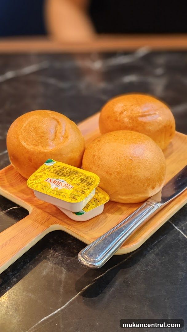Bread and Butter on Wooden Board