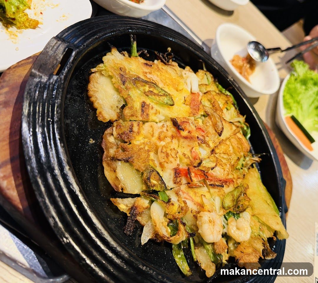 Food served in a black stone pan