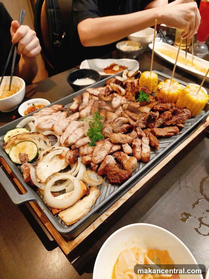 Grilled meat and vegetables on a grill plate