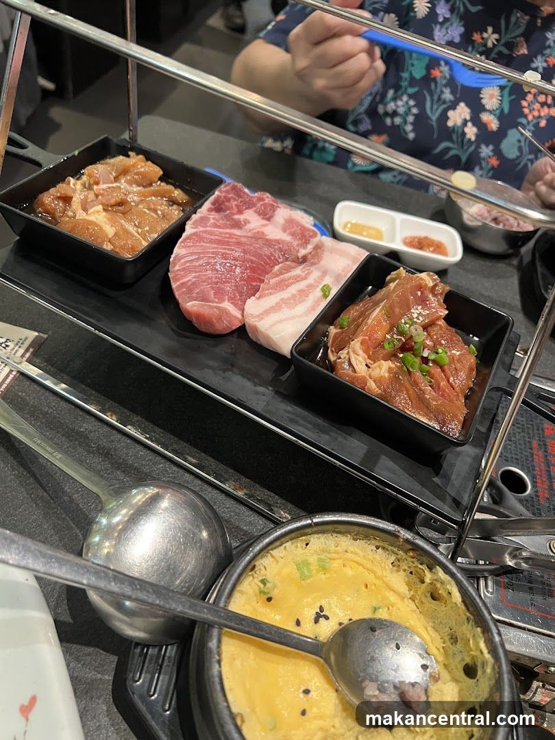 Grilled meat and side dishes at a restaurant