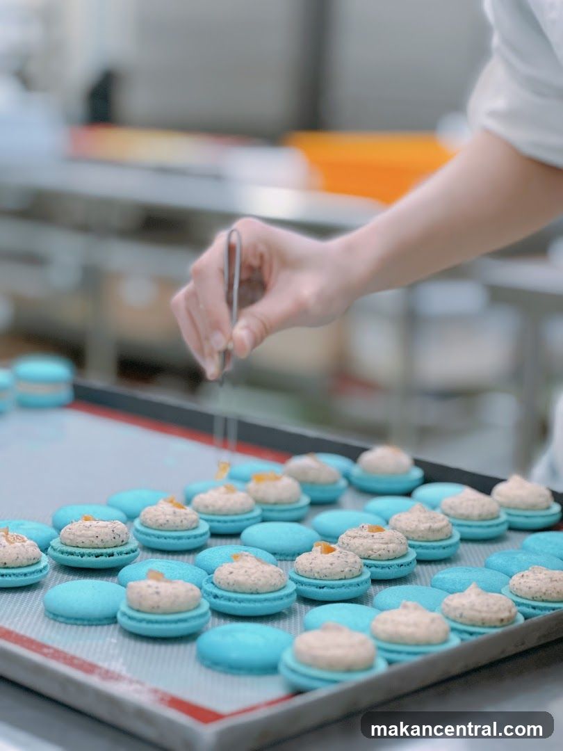 Baker preparing macarons