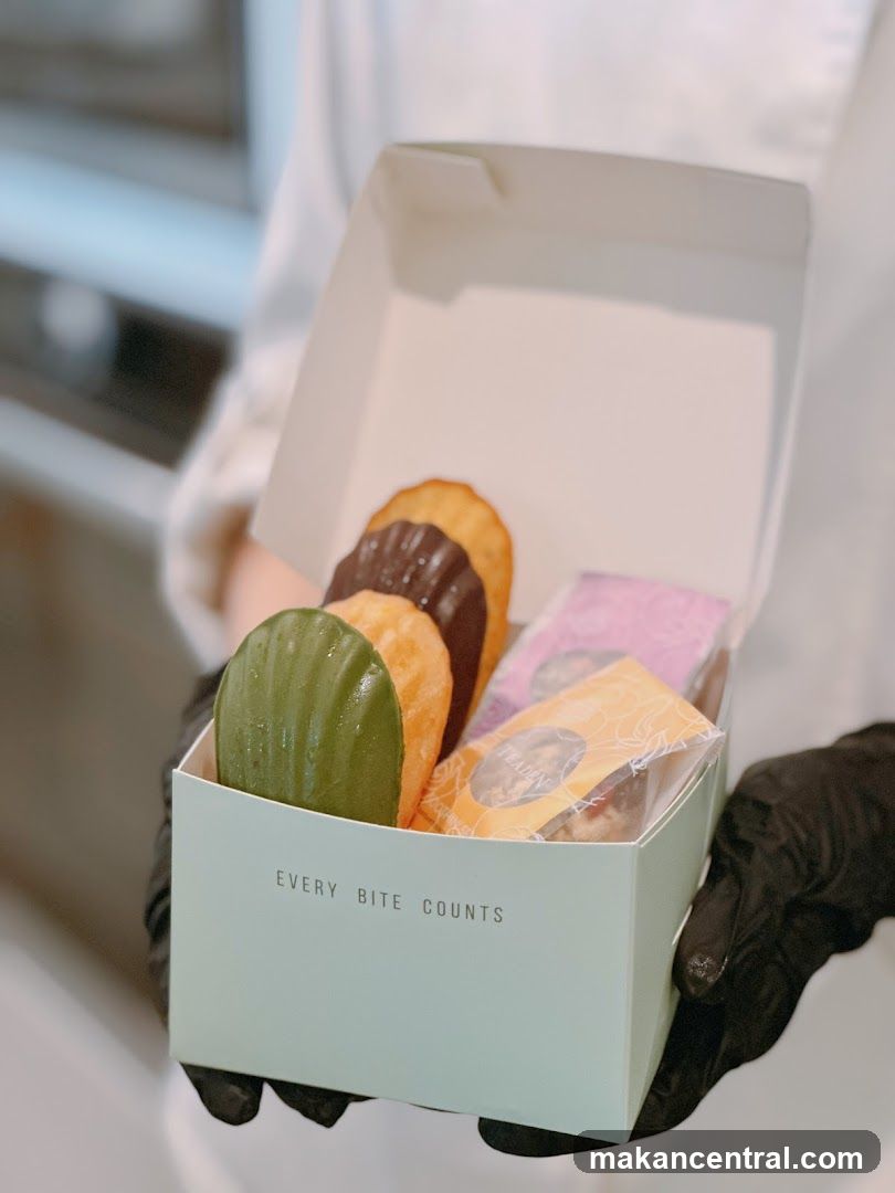 Hand holding pastry box