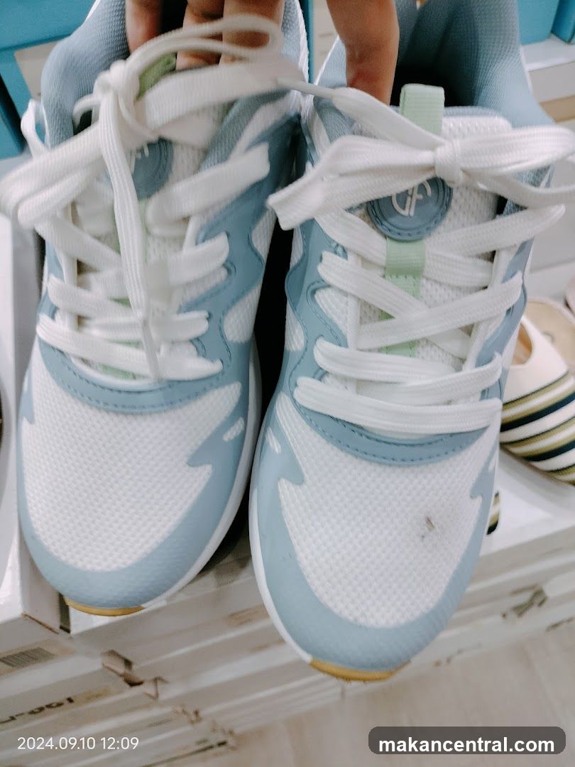 Pair of Light Blue and White Sneakers