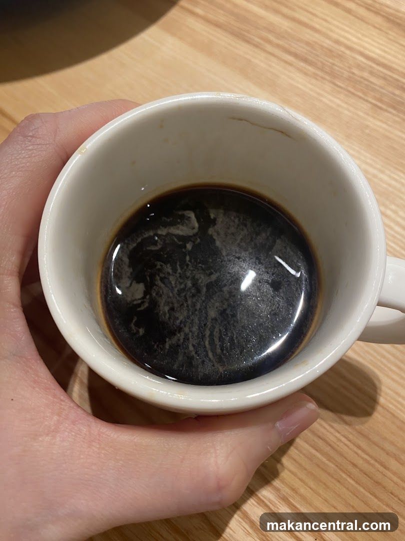 Hand holding coffee cup