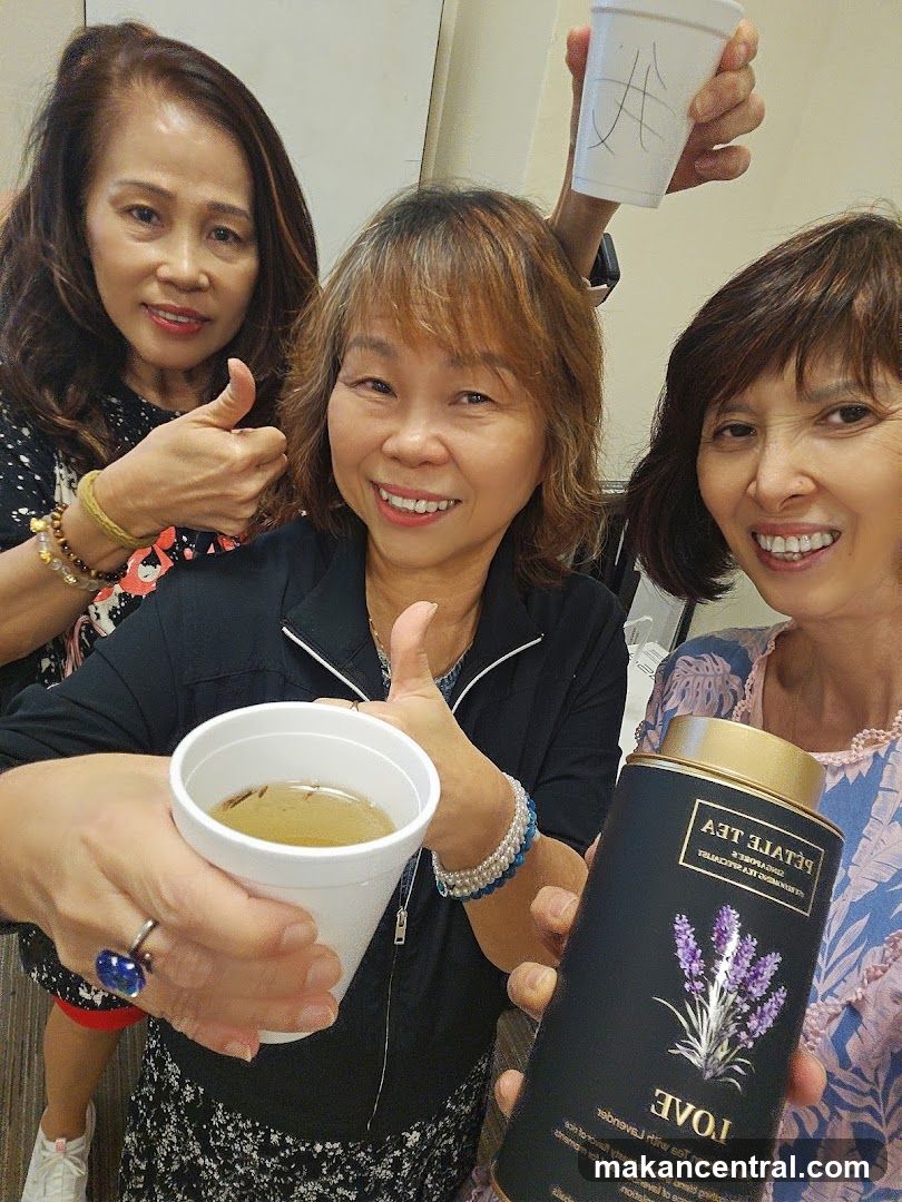 Group of women holding tea products