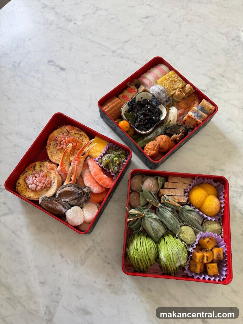Three Bento Boxes on Marble Surface
