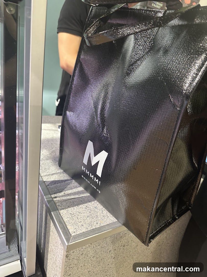 Black branded bag at counter