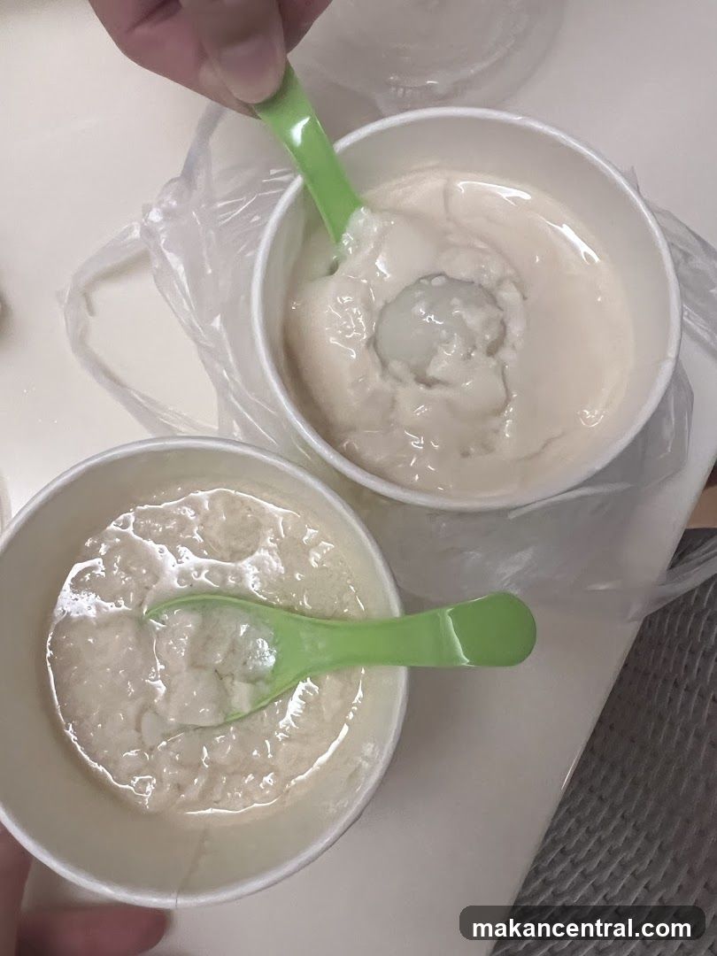 Two bowls of food with green spoons