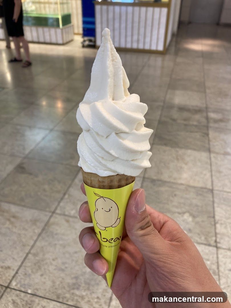 Hand holding soft serve ice cream