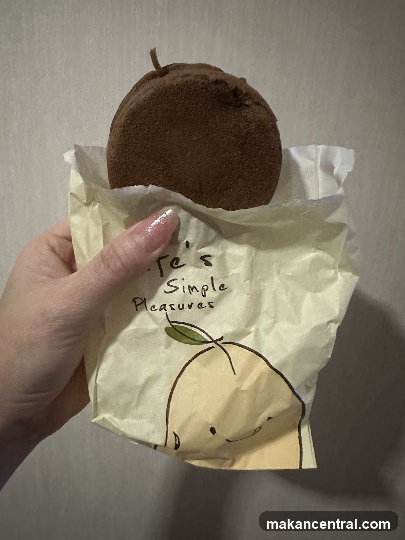Hand holding packaged dessert