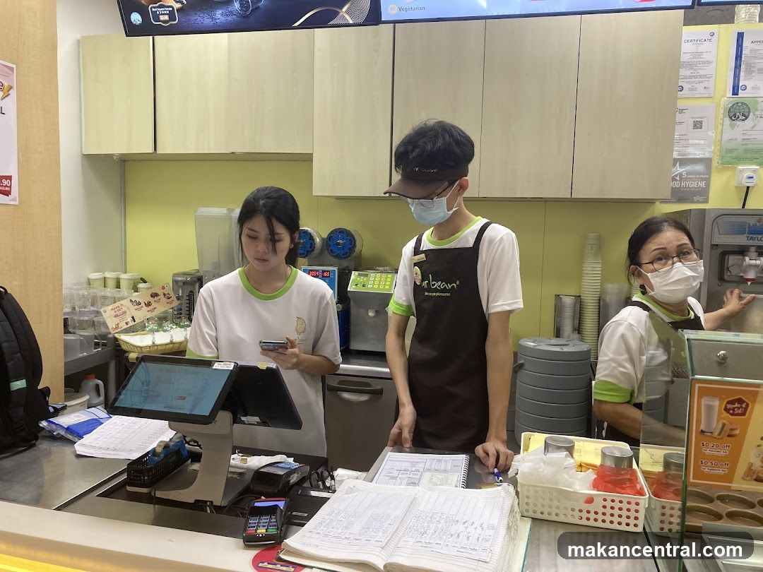 Staff at counter in food service area