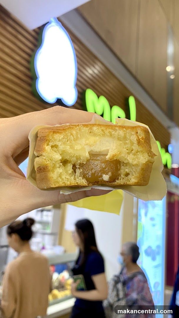 Hand holding a cut-open pastry