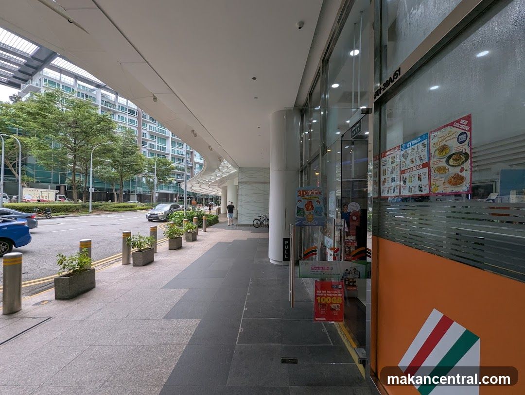 Storefront with glass facade and orange panel