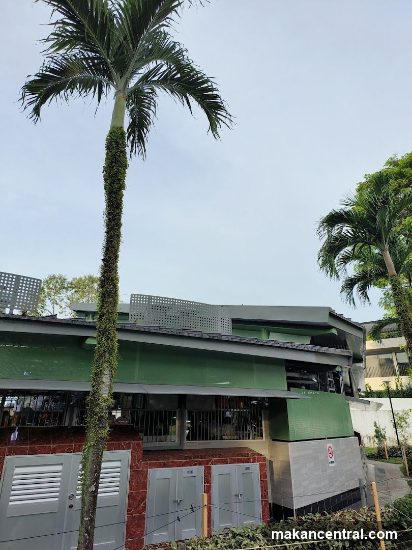 Building exterior with palm tree