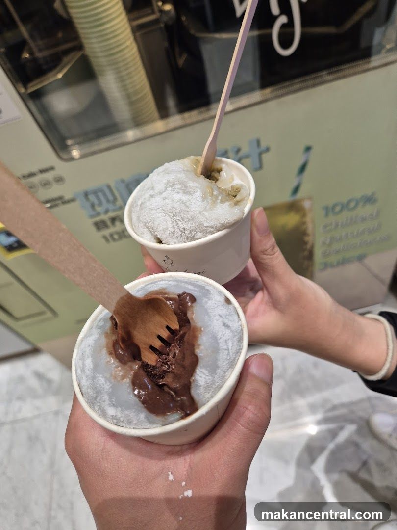 Hands holding ice cream cups