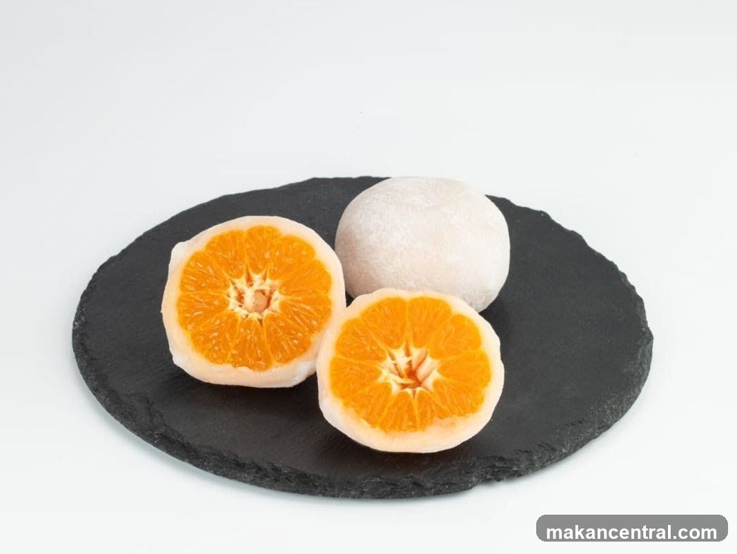 Orange-themed dessert on slate plate