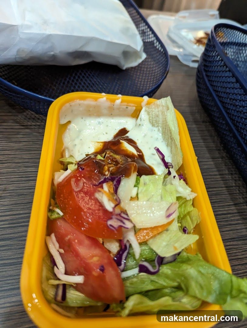 Salad in yellow container