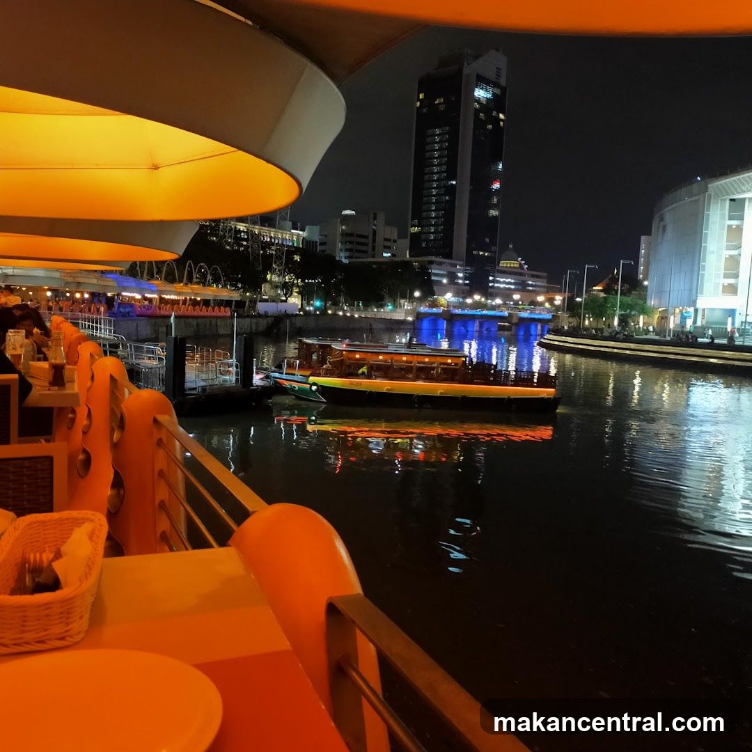 Nighttime riverside dining view