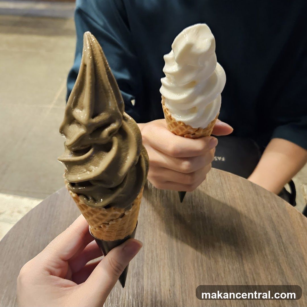 Ice Cream Cones Held in Hands